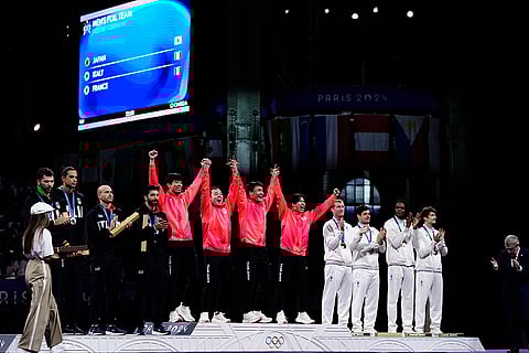 Fencers during 2024 Paris Olympics Games Fencing men's team foil competition medal ceremony